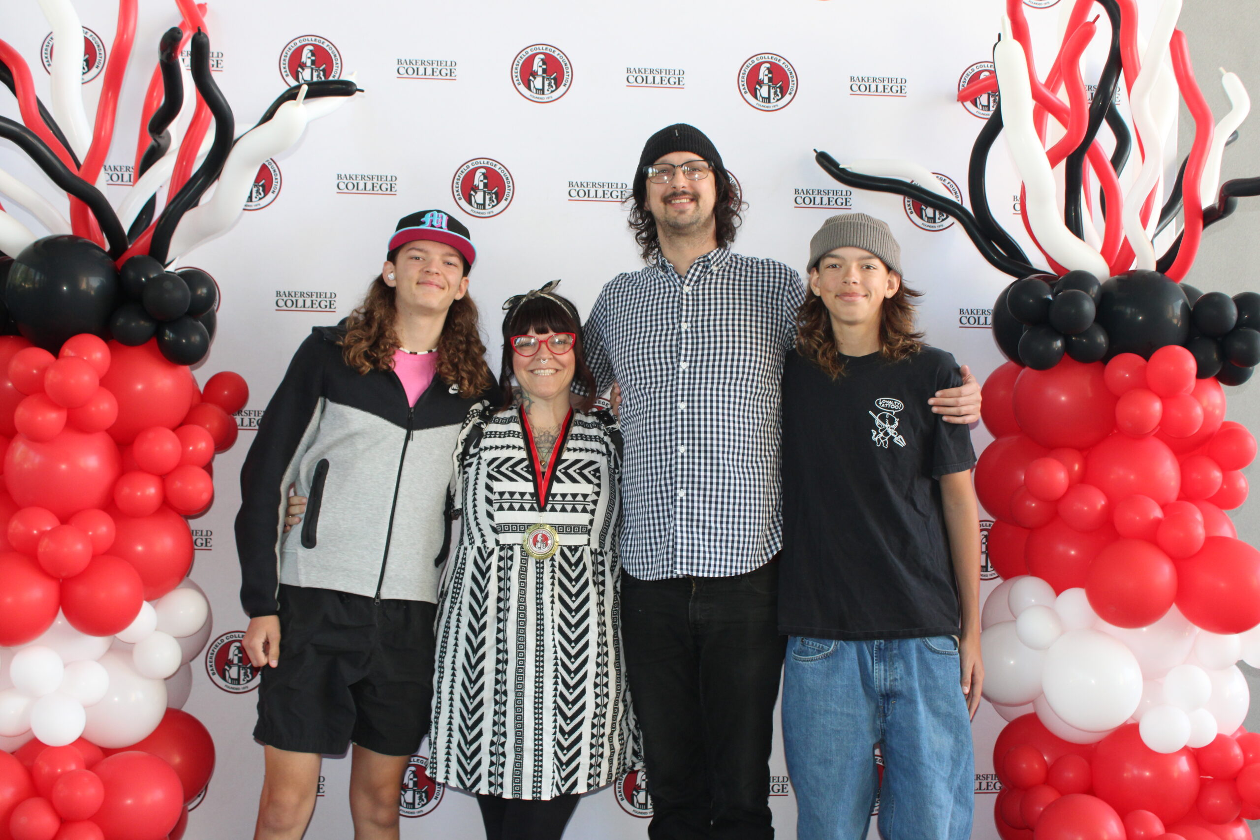 A scholarship recipient with her family