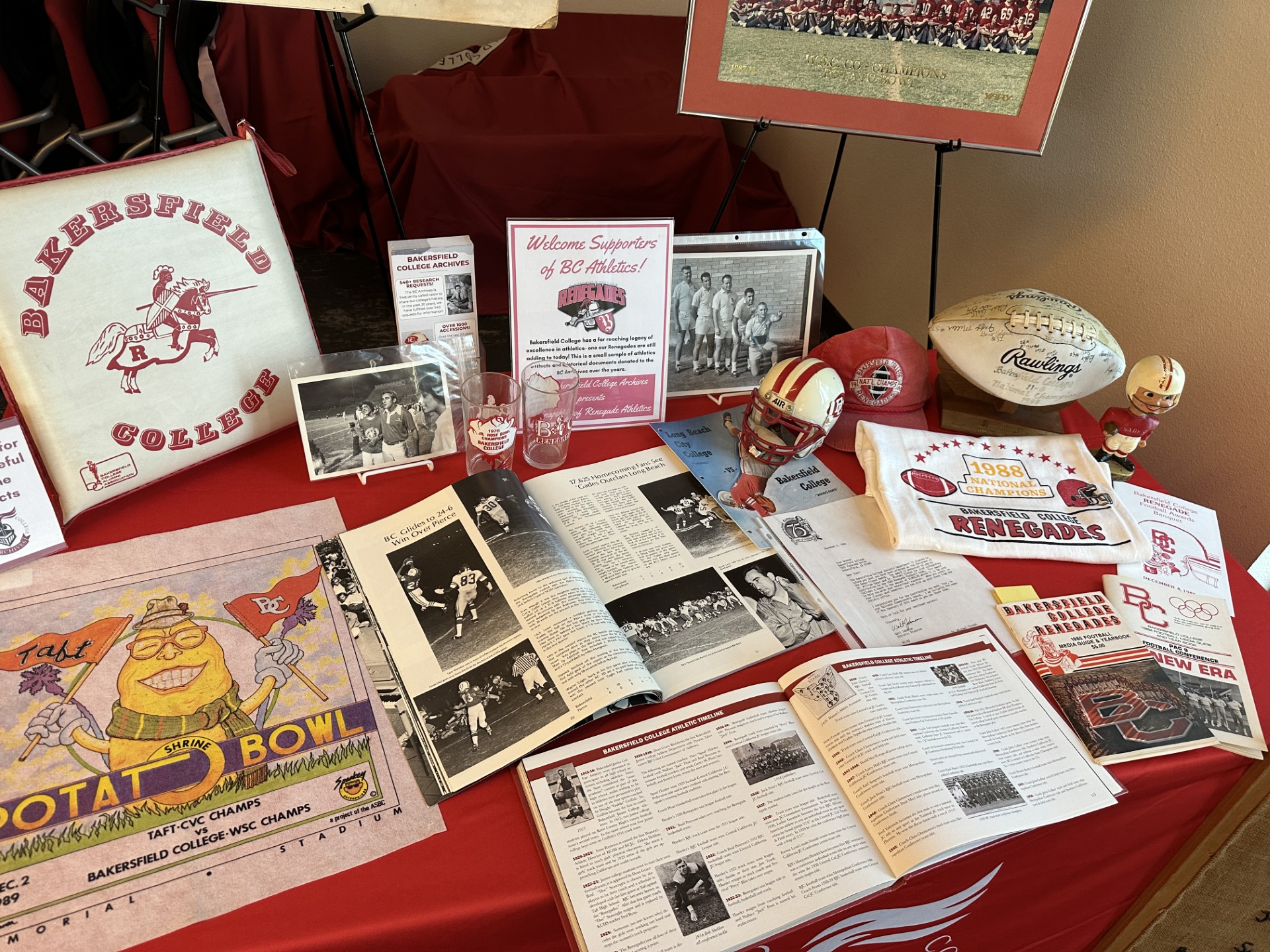 Artifacts from Past BC Sports spread on a table