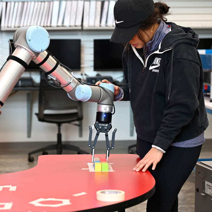 A student working on an engineering robot