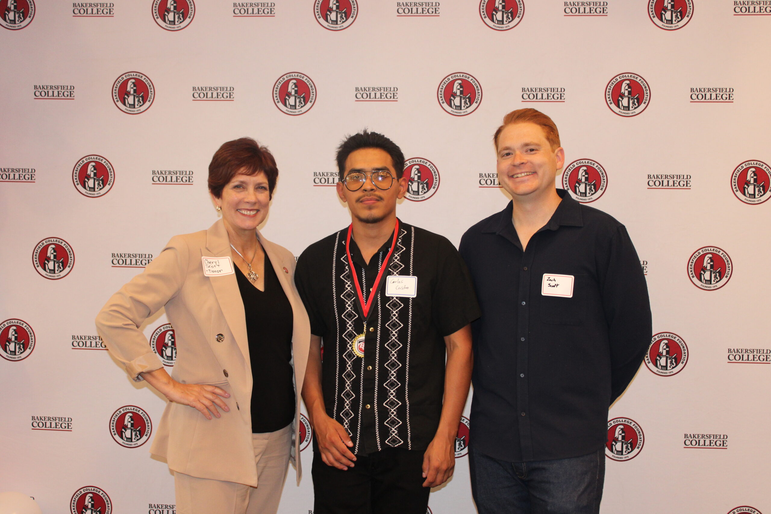 Cheryl and Zach Scott with their scholarship recipient Carlos.