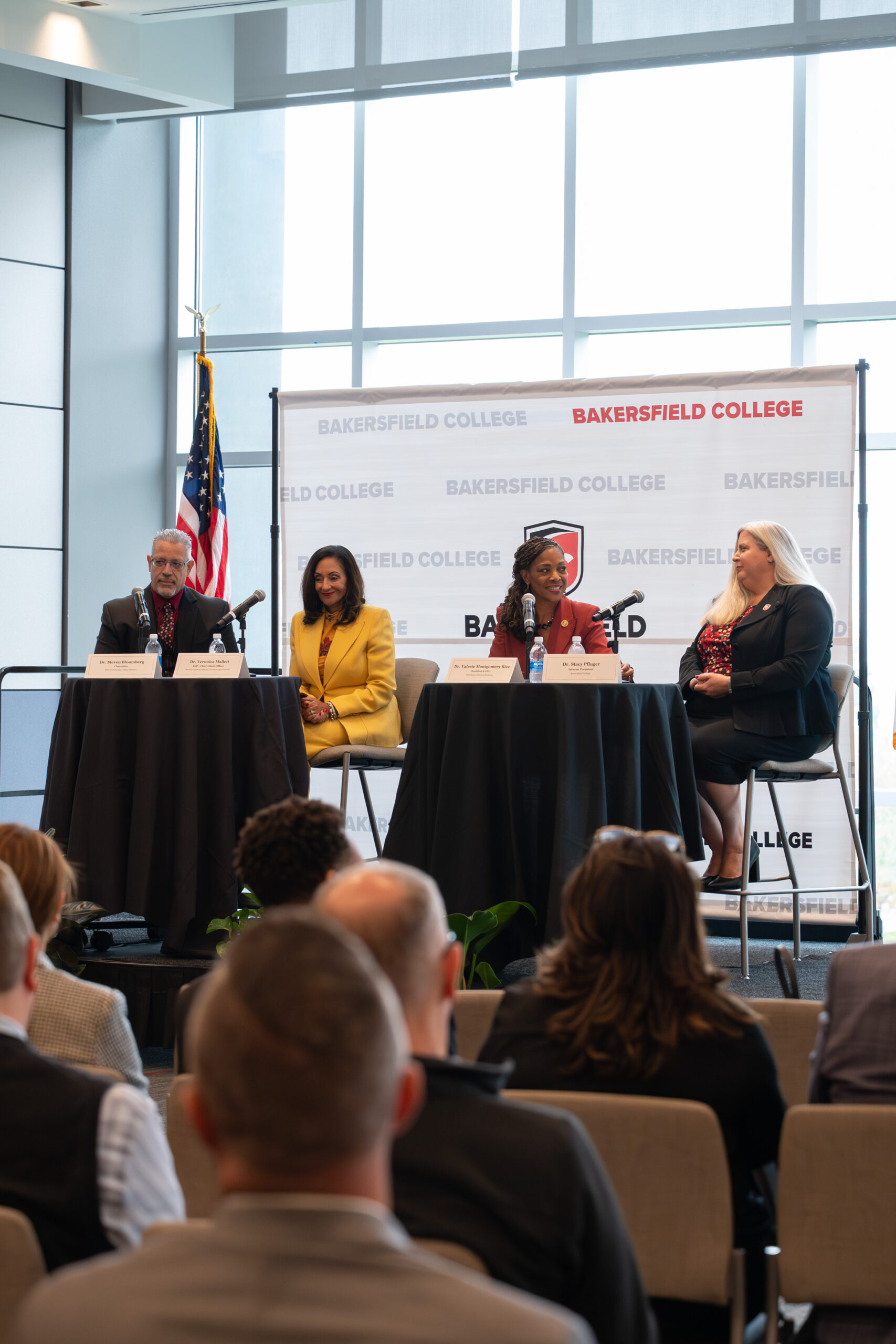 A group of people on dirt at the groundbreaking ceremony for the new Agriculture Sciences building