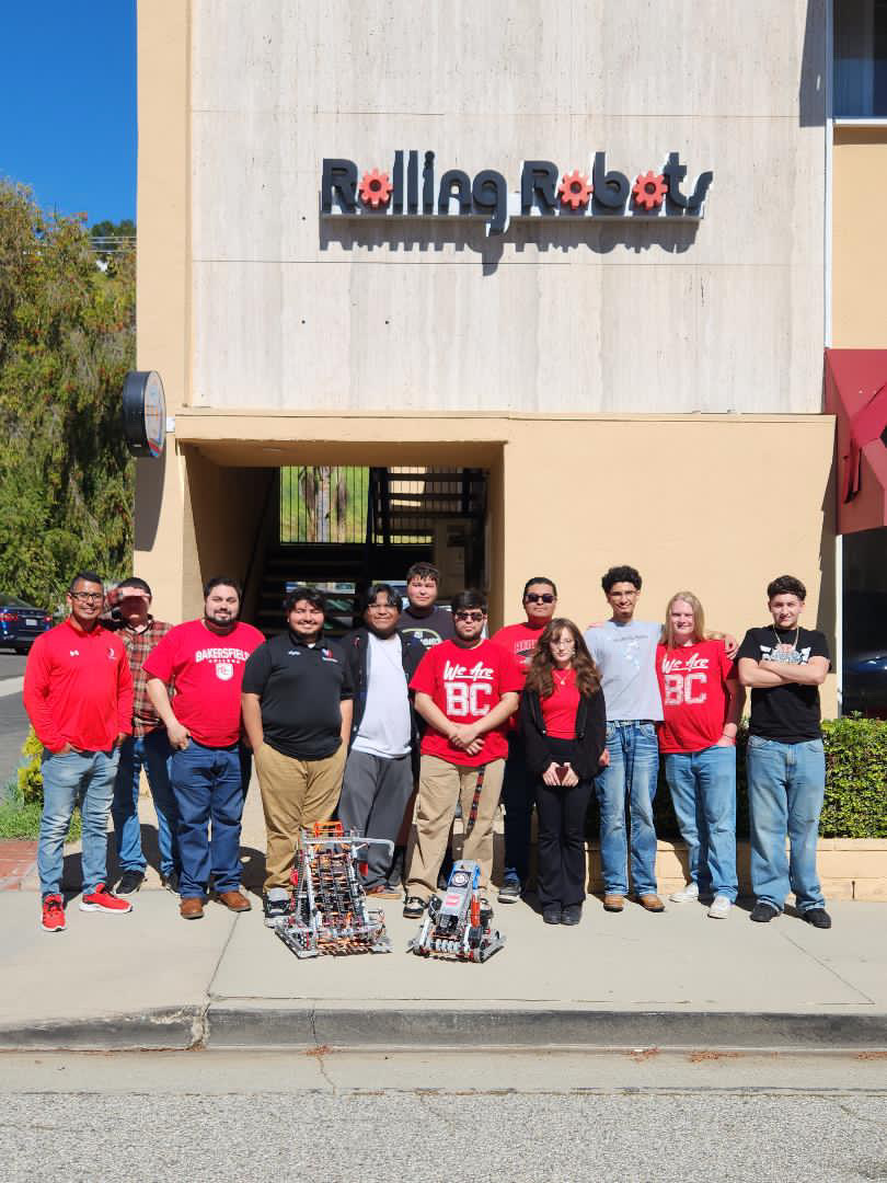 A group of people on dirt at the groundbreaking ceremony for the new Agriculture Sciences building