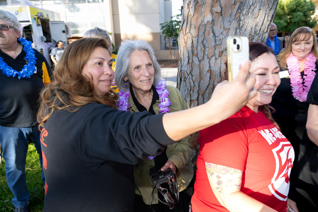 Scholarship recipient taking a photo with her donor
