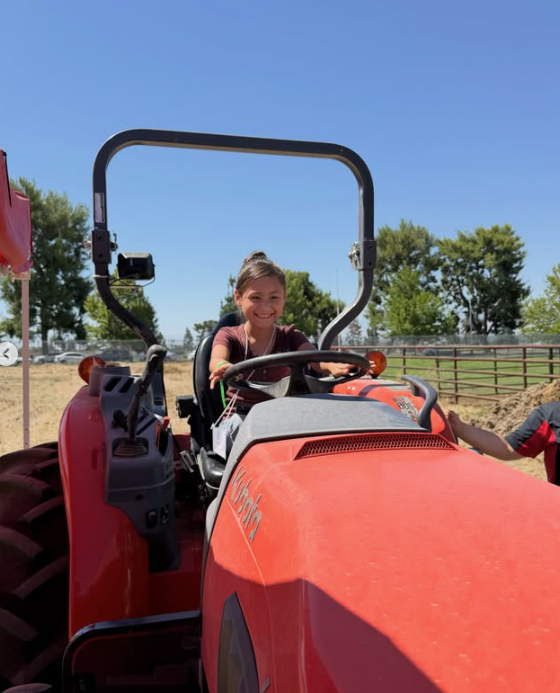 A girl on a tractor
