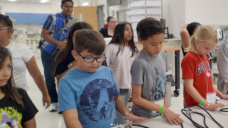 Kids learning about stethoscopes